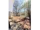 The backyard's unfinished area is sloped and ready for landscaping or other improvements at 209 East Wilson St # 25, Villa Rica, GA 30180
