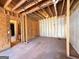 Unfinished basement featuring open framing, concrete walls and a door to the rest of the house at 209 East Wilson St # 25, Villa Rica, GA 30180