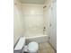 Full bath features white tiled shower-tub and toilet at 209 East Wilson St # 25, Villa Rica, GA 30180