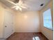 Empty bedroom features neutral walls, neutral carpet, ceiling fan and large window at 209 East Wilson St # 25, Villa Rica, GA 30180