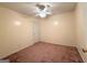 An empty bedroom features neutral walls, neutral carpet, and ceiling fan at 209 East Wilson St # 25, Villa Rica, GA 30180
