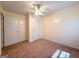 Bedroom features neutral walls, neutral carpet, ceiling fan and closet at 209 East Wilson St # 25, Villa Rica, GA 30180
