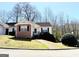 Inviting one-story home with vinyl siding, brick accents, trimmed bushes and leading sidewalk at 209 East Wilson St # 25, Villa Rica, GA 30180