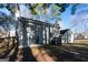 View of the home's backyard featuring mature trees, a fenced yard, and a patio area at 403 Sandown Dr, Peachtree City, GA 30269