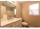 Clean bathroom with a modern vanity and a shower, plus a bright window at 403 Sandown Dr, Peachtree City, GA 30269