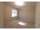 Bright bedroom featuring carpeting and a window, illuminated by natural light at 403 Sandown Dr, Peachtree City, GA 30269