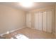 Bedroom featuring carpet with closets and a door; perfect for comfortable living at 403 Sandown Dr, Peachtree City, GA 30269