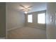 Bright and spacious bedroom with carpeting and two windows, offering plenty of natural light at 403 Sandown Dr, Peachtree City, GA 30269