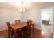 Dining room featuring chandelier and view to an adjacent room at 403 Sandown Dr, Peachtree City, GA 30269