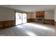 Cozy living room featuring a brick fireplace and sliding glass doors at 403 Sandown Dr, Peachtree City, GA 30269