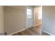 Mud room featuring white door, white trim, and plank flooring at 403 Sandown Dr, Peachtree City, GA 30269