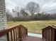 View of expansive backyard with lush green grass and a small garden at 245 Carole Dr, Oxford, GA 30054