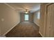 Spacious bedroom with plush carpet and a ceiling fan at 245 Carole Dr, Oxford, GA 30054