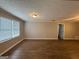 Bright and airy living room with modern flooring and neutral walls at 245 Carole Dr, Oxford, GA 30054