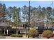 View of the community court and surrounding green space, ideal for Gathering fun at 7491 Hilltop Way, Atlanta, GA 30349