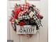 Home Sweet Home decorative wreath on a white front door at 7491 Hilltop Way, Atlanta, GA 30349