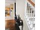 Hallway with stairs and table decorations that lead into the kitchen area at 7491 Hilltop Way, Atlanta, GA 30349