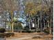 Well-maintained tennis court with surrounding landscape in a desirable community at 7491 Hilltop Way, Atlanta, GA 30349