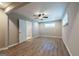 Bedroom with wood-look floors, ceiling fan, with an ensuite bathroom and a window at 1393 Vesta Ave, Atlanta, GA 30344