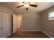 Bedroom featuring wood floors, neutral walls, and a doorway to another room at 1393 Vesta Ave, Atlanta, GA 30344