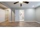 Bedroom showcasing wood-look floors, ceiling fan, with access to a closet and an ensuite bathroom at 1393 Vesta Ave, Atlanta, GA 30344