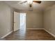 Bright bedroom with hardwood floors and neutral colored walls, plus a ceiling fan at 1393 Vesta Ave, Atlanta, GA 30344