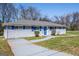 Single-story home with blue trim, including shutters and front door at 1393 Vesta Ave, Atlanta, GA 30344