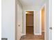 Hallway with a view of the neutral colored walls, hardwood floors, and white trim at 1393 Vesta Ave, Atlanta, GA 30344