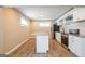 Bright kitchen with stainless steel appliances, granite countertops, and a center island at 1393 Vesta Ave, Atlanta, GA 30344