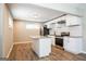 Modern kitchen features white cabinets, granite countertops, and stainless steel appliances at 1393 Vesta Ave, Atlanta, GA 30344
