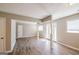 Spacious living room with hardwood floors and natural light streaming in from the glass panel front door at 1393 Vesta Ave, Atlanta, GA 30344