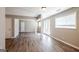 Open-concept living room featuring hardwood floors, neutral walls, and a bright entry at 1393 Vesta Ave, Atlanta, GA 30344