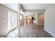 Open concept layout, living room leading to kitchen, with hardwood floors and modern finishes at 1393 Vesta Ave, Atlanta, GA 30344