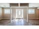Bright living room featuring hardwood floors and a front door with sidelight windows at 1393 Vesta Ave, Atlanta, GA 30344