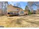 Spacious backyard featuring a deck and ample green space, ideal for outdoor activities at 423 Holly Grove Church Rd, Peachtree City, GA 30269