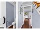 Hallway bathroom with classic fixtures, tile flooring and access to upstairs and living room at 423 Holly Grove Church Rd, Peachtree City, GA 30269