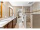 Bright bathroom featuring a marble counter top, tile floors and a glass enclosed shower at 423 Holly Grove Church Rd, Peachtree City, GA 30269