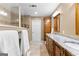 Bathroom boasts granite countertops, double sinks, vanity, and a walk-in shower at 423 Holly Grove Church Rd, Peachtree City, GA 30269