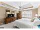 Spacious bedroom features a tray ceiling and modern ceiling fan at 423 Holly Grove Church Rd, Peachtree City, GA 30269