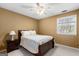 Bedroom featuring a queen bed with a dark wood frame, carpet and natural light at 423 Holly Grove Church Rd, Peachtree City, GA 30269