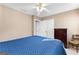 Bedroom with ceiling fan, closet and dresser in a neutral color scheme at 423 Holly Grove Church Rd, Peachtree City, GA 30269