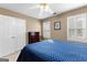 Bedroom features include windows with shutters, ceiling fan, and closet at 423 Holly Grove Church Rd, Peachtree City, GA 30269