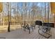Outdoor deck with metal patio furniture, perfect for relaxation or entertaining guests at 423 Holly Grove Church Rd, Peachtree City, GA 30269
