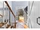 Inviting foyer with hardwood floors, staircase, and natural light streaming through the front door at 423 Holly Grove Church Rd, Peachtree City, GA 30269