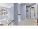 Bright foyer with hardwood steps, an arched window and a pendant light fixture at 423 Holly Grove Church Rd, Peachtree City, GA 30269