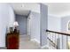 Bright hallway on the second floor of a home with neutral-toned walls at 423 Holly Grove Church Rd, Peachtree City, GA 30269
