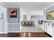 Open-concept view from the dining area showcasing the kitchen's island seating and modern finishes at 423 Holly Grove Church Rd, Peachtree City, GA 30269