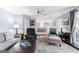 Open-concept living area showcasing the kitchen, fireplace, and ample seating at 423 Holly Grove Church Rd, Peachtree City, GA 30269