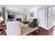 Cozy living room featuring hardwood floors, a fireplace, and comfortable seating arrangements at 423 Holly Grove Church Rd, Peachtree City, GA 30269