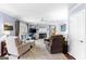 Spacious living room featuring a fireplace with built-in shelving and plush carpeting at 423 Holly Grove Church Rd, Peachtree City, GA 30269